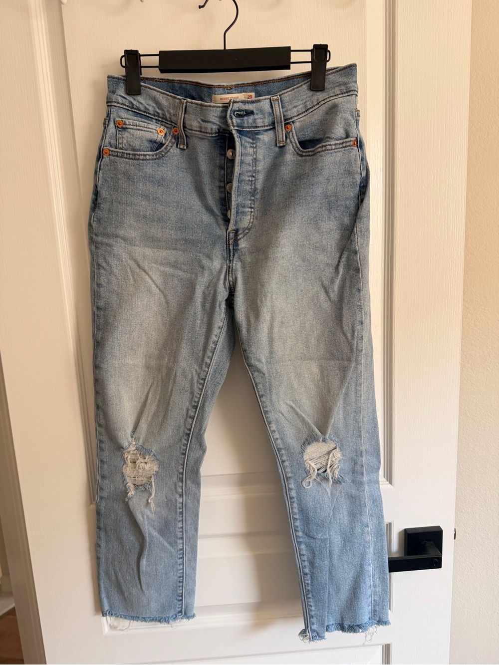 Levi’s women’s Light Wash Distressed Button-Fly Jeans